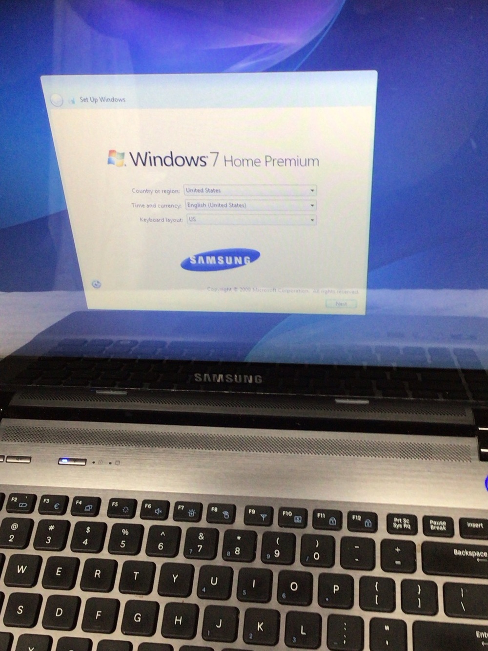 Samsung Silver and Black Laptop with Windows 7 Setup Screen